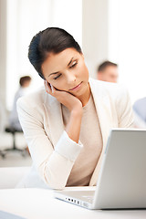 Image showing businesswoman with laptop computer at work