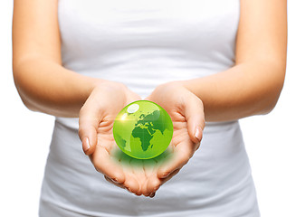 Image showing woman hands holding green sphere globe