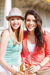 Image showing girls with drinks on the beach