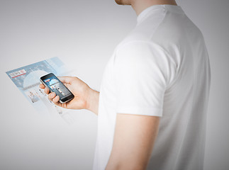 Image showing man with smartphone reading news