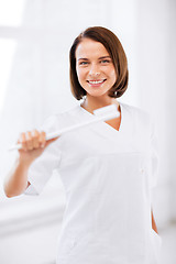 Image showing dentist with toothbrush in hospital