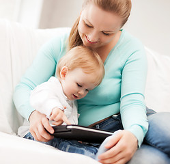 Image showing mother and adorable baby with tablet pc