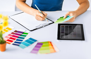 Image showing woman working with color samples for selection