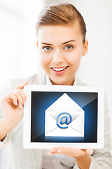 Image showing businesswoman holding tablet pc with email sign