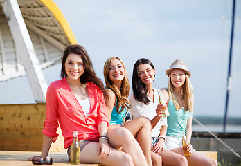 Image showing girls with drinks on the beach