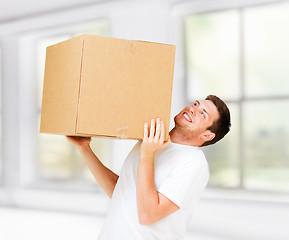 Image showing man carrying carton heavy box