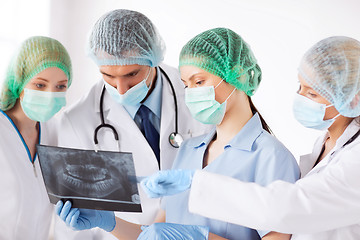 Image showing young group of doctors looking at x-ray