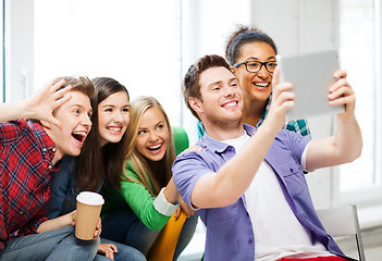 Image showing students making picture with tablet pc at school