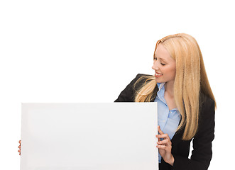 Image showing businesswoman with white blank board