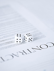 Image showing contract paper with gambling dices