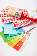 Image showing paintbrush, gloves and pantone samplers