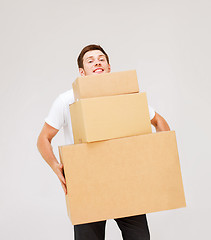 Image showing young man carrying carton boxes