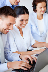 Image showing group of people working with laptops in office