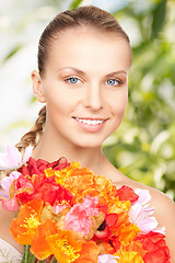 Image showing young woman with bouquet of flowers