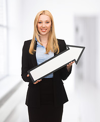 Image showing businesswoman with direction arrow sign