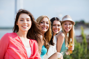 Image showing girls with drinks on the beach