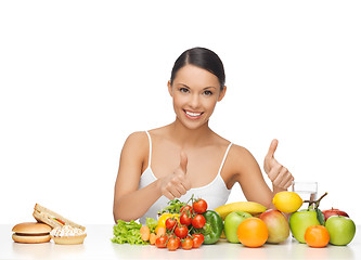 Image showing woman with fruits showing thumbs up