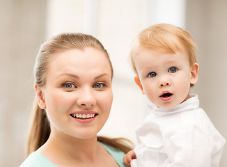 Image showing happy mother with adorable baby