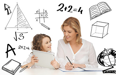 Image showing girl and mother doing homework with tablet pc