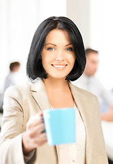 Image showing beautiful businesswoman with cup of coffee