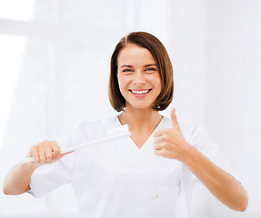 Image showing dentist with toothbrush in hospital