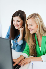 Image showing students looking at tablet pc at school