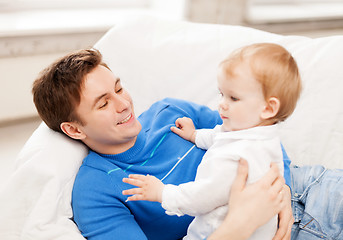 Image showing happy father with adorable baby