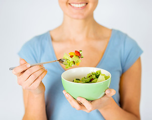 Image showing woman eating salad with vegetables