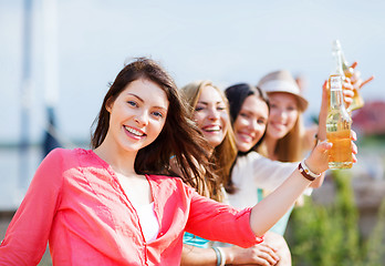 Image showing girls with drinks on the beach