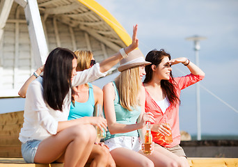 Image showing girls with drinks on the beach