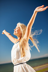 Image showing beautiful woman enjoying summer outdoors