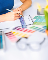 Image showing woman working with color samples for selection