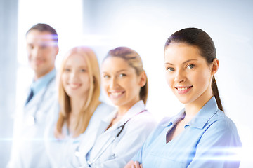 Image showing female doctor in front of medical group