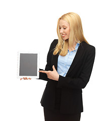 Image showing smiling woman pointing at tablet pc