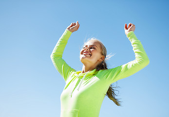 Image showing woman runner celebrating victory