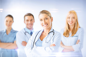 Image showing female doctor in front of medical group