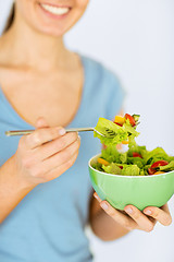 Image showing woman eating salad with vegetables