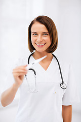 Image showing doctor with thermometer and stethoscope