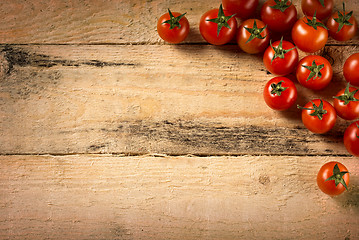 Image showing cherry tomatoes on wood background