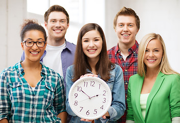 Image showing group of students at school with clock