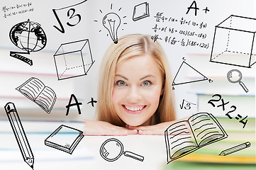 Image showing student with stack of books and doodles