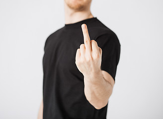 Image showing man showing middle finger