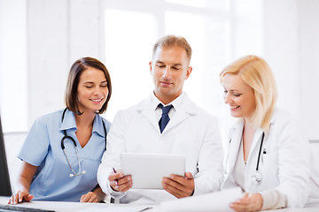 Image showing doctors looking at tablet pc