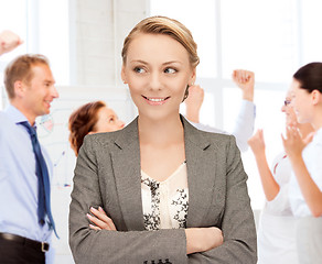 Image showing businesswoman celebrating succes in office