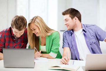 Image showing students writing something at school