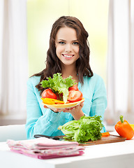 Image showing woman in the kitchen with vegetables