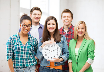 Image showing group of students at school with clock