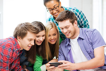 Image showing students looking at smartphone at school