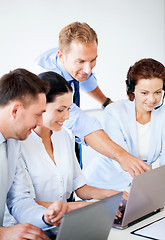 Image showing group of people working in call center