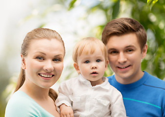 Image showing happy family with adorable child